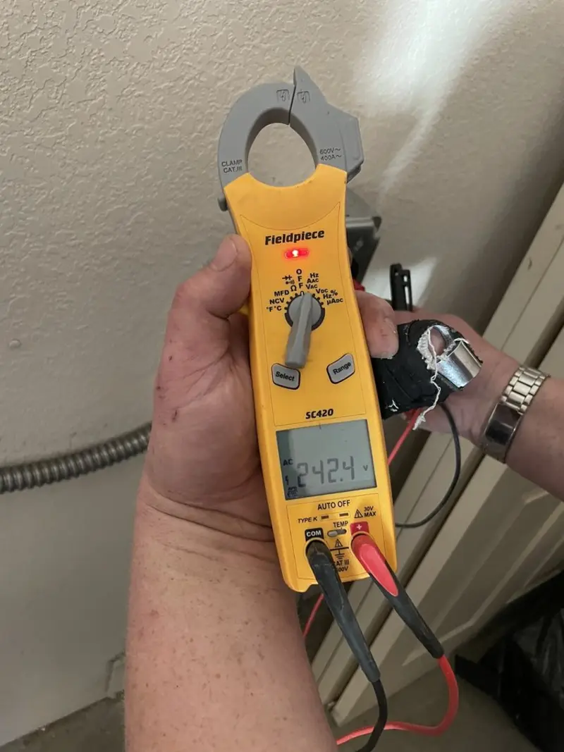 Voltage testing with clamp meter during Whole House Surge Protector in Branson
